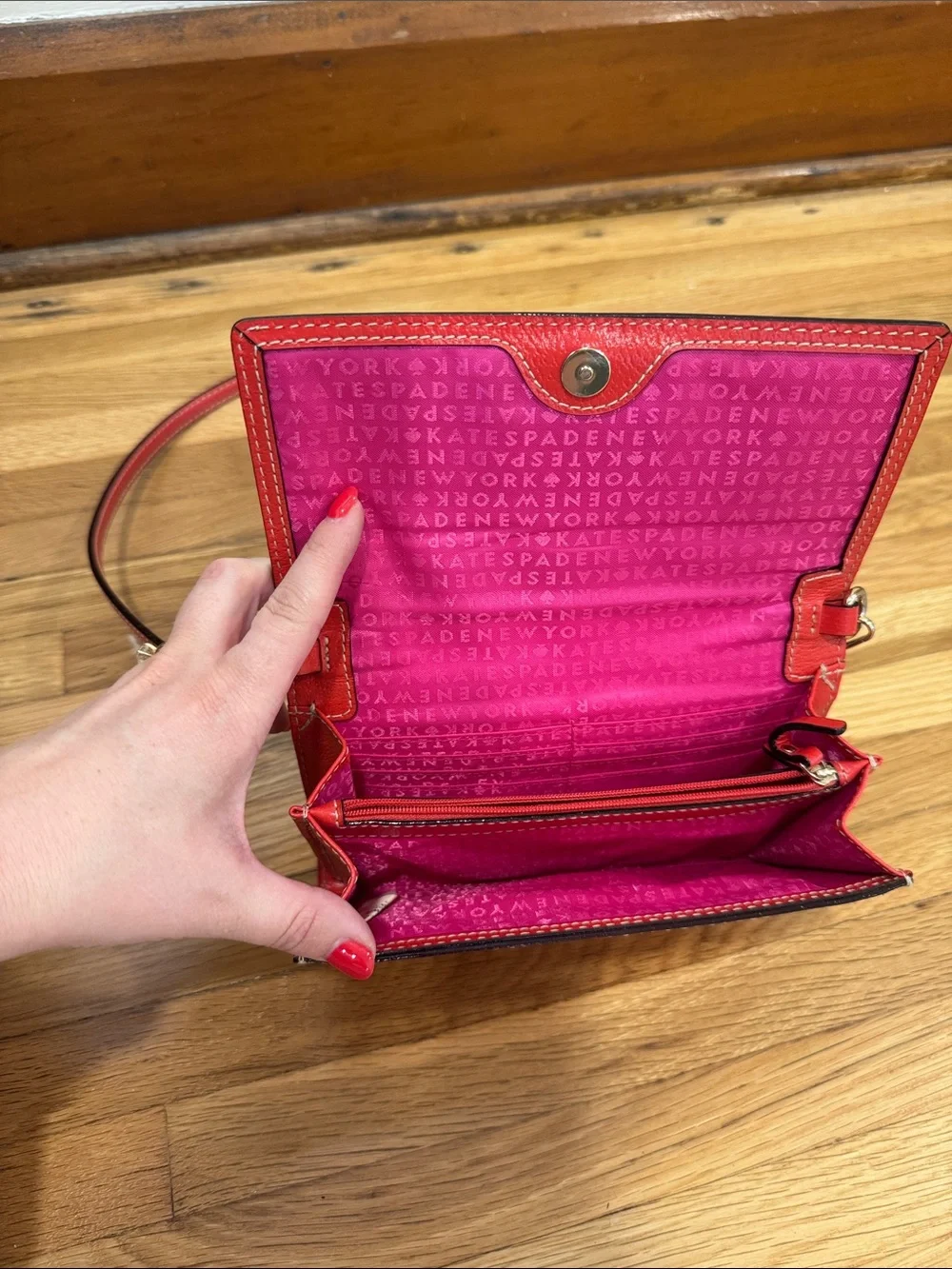 kate spade Red Pebbled Leather Crossbody Wallet with Gold Logo Plate